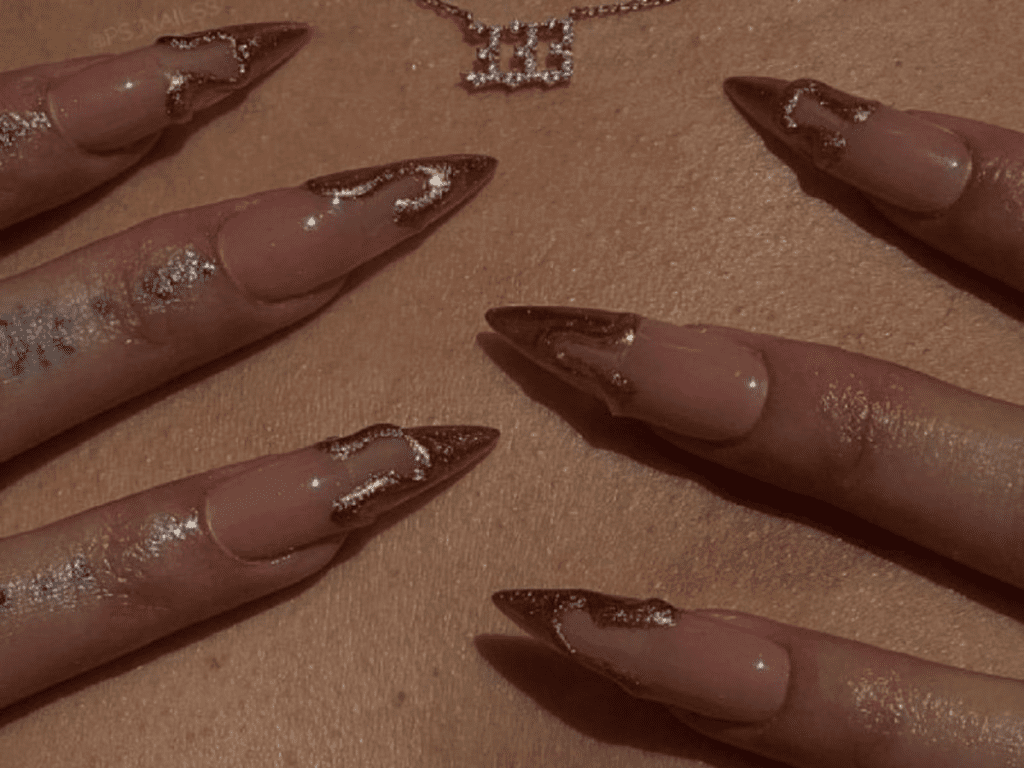 Obsessed with gold? This post will feature 99+ gold nail ideas that are foolproof gold nail designs that drip with luxury. Whether you’re getting ready for a wedding, party, birthday, or just want to feel like a million bucks, we’ve got the perfect gold nail design for you.