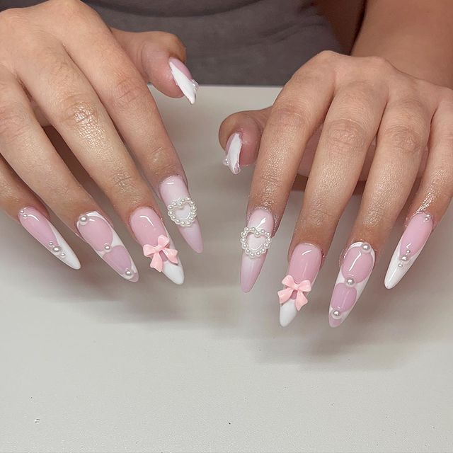 11. Pink nail design by acrylicsbyfatima—Want to rock pink nails but don't have great inspo? Here is the list of nail artists who have the best pink nail designs ever.