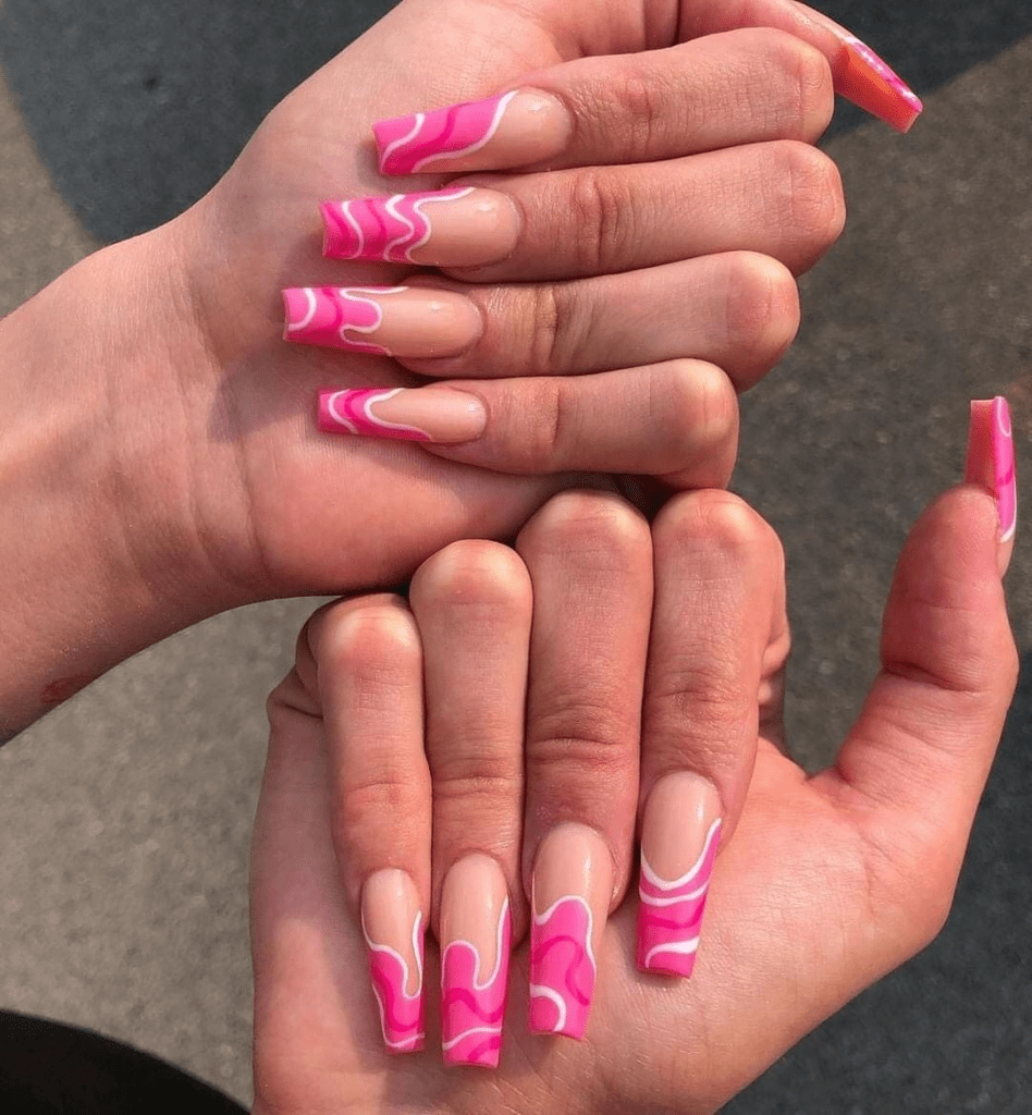 3.  Pink nail design by thenailbarhoddesdon—Want to rock pink nails but don't have great inspo? Here is the list of nail artists who have the best pink nail designs ever.
